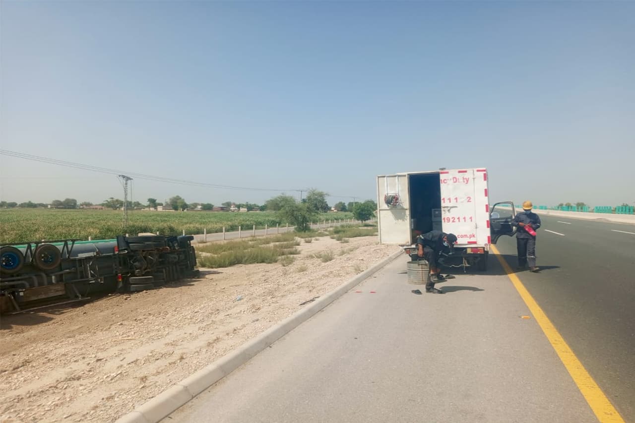 ATS Humsafar crew recovering an overturned tanker on the motorway shoulder